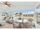 Bright sunroom has lots of seating for entertaining and lots of windows for natural light at 1430 Mohawk Cir, Tavares, FL 32778