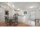 Bright dining area with tiled floors and clear view into kitchen area at 1508 Dellano Way, The Villages, FL 32159