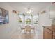 Kitchen nook with a breakfast table with seating by a window and ceiling fan at 1508 Dellano Way, The Villages, FL 32159