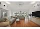 Bright and airy living room featuring wood floors and comfortable seating perfect for entertaining at 1508 Dellano Way, The Villages, FL 32159