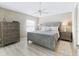 Cozy bedroom with neutral tones, a stylish bed frame, and natural light from the window at 1558 Summerchase Loop, The Villages, FL 32162