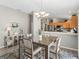 Cozy dining area with modern chandelier, flowing into the open concept living spaces at 1558 Summerchase Loop, The Villages, FL 32162