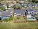 Stunning aerial view of a two-story home featuring a spacious backyard with lush green grass at 16126 Bristol Lake Cir, Orlando, FL 32828