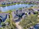 Aerial view showcasing the home's premium location with lake frontage and three-car garage at 16126 Bristol Lake Cir, Orlando, FL 32828