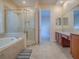 This bathroom has a soaking tub, walk-in shower, and a dual sink vanity at 16126 Bristol Lake Cir, Orlando, FL 32828