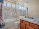 Bathroom featuring a bathtub and a granite vanity at 16126 Bristol Lake Cir, Orlando, FL 32828