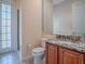 Cozy bathroom featuring granite counters and a stand up shower, providing a comfortable space at 16126 Bristol Lake Cir, Orlando, FL 32828