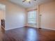 Bedroom with hardwood floors, window and peach colored walls at 16126 Bristol Lake Cir, Orlando, FL 32828