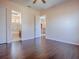 Bedroom with hardwood floors that leads to the Primary bath at 16126 Bristol Lake Cir, Orlando, FL 32828