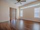 Bright bedroom featuring lots of natural light and dark wood floors at 16126 Bristol Lake Cir, Orlando, FL 32828