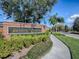 Entrance to Bristol Estates showcasing a brick sign and mature landscaping at 16126 Bristol Lake Cir, Orlando, FL 32828