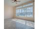 The living room features large windows offering scenic views and natural light at 16126 Bristol Lake Cir, Orlando, FL 32828