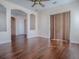 Large open-concept area with dark wood floors and lots of natural light, perfect for entertaining at 16126 Bristol Lake Cir, Orlando, FL 32828