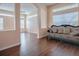 Stylish living room with dark wood floors, abundant light, and an elegant archway at 16126 Bristol Lake Cir, Orlando, FL 32828