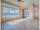 The living room features large windows offering scenic views and natural light at 16126 Bristol Lake Cir, Orlando, FL 32828