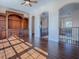 Open living room with hardwood floors and custom wooden shelving at 16126 Bristol Lake Cir, Orlando, FL 32828