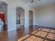 Upstairs loft with hardwood floors and arched entryway at 16126 Bristol Lake Cir, Orlando, FL 32828