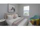 Charming bedroom with a comfortable bed, stylish furniture, and a bright window at 16434 Hamlin Hills Rd, Winter Garden, FL 34787