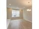 Bright dining room with wood-style flooring, recessed lighting, and a modern chandelier at 16434 Hamlin Hills Rd, Winter Garden, FL 34787