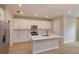 Spacious kitchen featuring white cabinets, stainless steel appliances, and a large kitchen island at 16434 Hamlin Hills Rd, Winter Garden, FL 34787