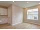 Bright and airy living space featuring wood-style flooring and a large window for natural light at 16434 Hamlin Hills Rd, Winter Garden, FL 34787