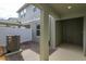 View of the patio, white fence, AC unit and the side entry door at 16434 Hamlin Hills Rd, Winter Garden, FL 34787