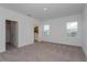 Spacious bedroom featuring plush carpeting, a walk-in closet, and an ensuite bathroom at 16465 Hamlin View St, Winter Garden, FL 34787