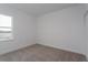 Bright bedroom featuring a window, neutral carpet and white walls for a calm atmosphere at 16465 Hamlin View St, Winter Garden, FL 34787