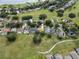 Wide aerial shot showcases a neighborhood's well-maintained lawns and homes, some featuring private pools and solar panels at 16627 Rockwell Heights Ln, Clermont, FL 34711