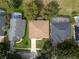 Overhead view of a well-kept home with mature landscaping, adjacent to neighboring homes and community at 16627 Rockwell Heights Ln, Clermont, FL 34711