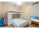 Bedroom features a white bunk bed, carpet, a ceiling fan, and a TV at 16627 Rockwell Heights Ln, Clermont, FL 34711