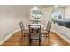 Cozy dining area with wood floors and a view of the backyard at 16627 Rockwell Heights Ln, Clermont, FL 34711