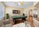 Game room with a ping pong table, dart board, and view to the main living areas through glass doors at 16627 Rockwell Heights Ln, Clermont, FL 34711