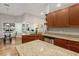 Spacious kitchen with granite countertops, stainless steel appliances, and wood cabinets at 16627 Rockwell Heights Ln, Clermont, FL 34711