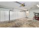 Spacious garage with painted walls, built in storage, and door to the outside at 17764 Se 95Th Ct, Summerfield, FL 34491