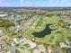 Expansive aerial view of community showcasing golf course, lakes and neatly arranged homes at 17899 Se 115Th Cir, Summerfield, FL 34491