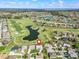 Expansive aerial view of community showcasing golf course, lakes and neatly arranged homes at 17899 Se 115Th Cir, Summerfield, FL 34491