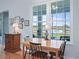 Bright dining area with golf course views from large windows at 17899 Se 115Th Cir, Summerfield, FL 34491