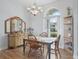 Cozy dining room with a chandelier, natural light, and view to a decorative dresser at 17899 Se 115Th Cir, Summerfield, FL 34491