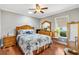 Comfortable bedroom with hardwood floors, ceiling fan, and traditional furniture at 1840 Madero Dr, The Villages, FL 32159