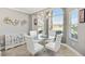 Bright breakfast nook featuring a large window, chandelier and modern furniture at 1840 Madero Dr, The Villages, FL 32159