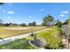 Relaxing view of the golf course and sand trap directly off of the back screened lanai at 1840 Madero Dr, The Villages, FL 32159