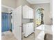 View of the laundry room with washer, dryer and sink next to the front door at 1840 Madero Dr, The Villages, FL 32159