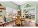 Cozy dining area featuring a wood table and chairs with natural light at 1914 Antonia Pl, The Villages, FL 32159