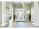 Bright foyer features tiled floor, glass paneled door and a large closet for storage at 1914 Antonia Pl, The Villages, FL 32159