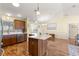 Open-concept kitchen with breakfast bar and stainless steel dishwasher at 2010 Harston Trl, The Villages, FL 32162