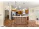 Kitchen with large island and stainless appliances at 2010 Harston Trl, The Villages, FL 32162