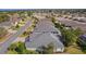 Aerial perspective highlighting roofs of adjacent houses, showcasing the community layout and landscaping at 2022 Abordale Ln, The Villages, FL 32162