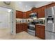 Kitchen with stainless steel appliances and ample storage space at 2022 Abordale Ln, The Villages, FL 32162