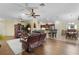 Open-concept living room flowing into the kitchen, perfect for entertaining guests at 2022 Abordale Ln, The Villages, FL 32162